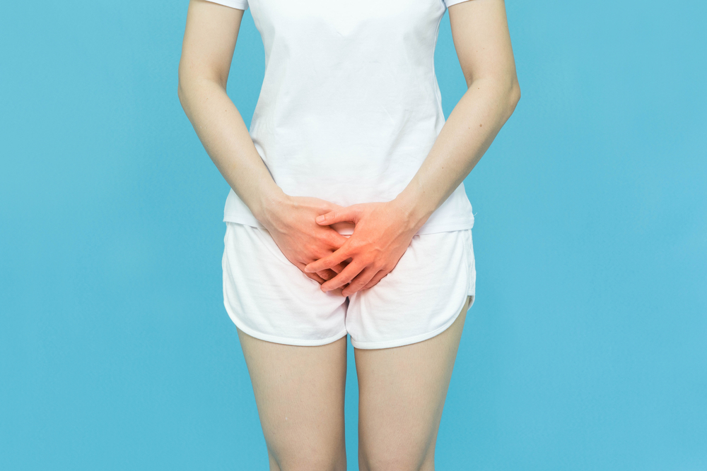 woman in pain with a UTI